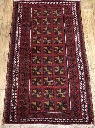 A Turkish red ground prayer rug and two other rugs, 154cm x 108cm, 159cm x 113cm and 149 x 100cm